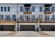 Townhouse exterior with private balconies and attached garages at 1072 Brookglynn Trce, Decatur, GA 30032
