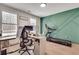 Contemporary home office with modern decor, treadmill and bright natural light at 1072 Brookglynn Trce, Decatur, GA 30032