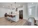 Contemporary kitchen with white cabinetry, stainless steel appliances, and breakfast bar at 1072 Brookglynn Trce, Decatur, GA 30032