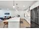 Bright, open-concept kitchen featuring a long island and views into the living area at 1072 Brookglynn Trce, Decatur, GA 30032