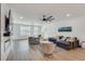 Open-concept living room featuring hardwood floors, comfortable seating, and natural light at 1072 Brookglynn Trce, Decatur, GA 30032