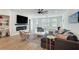 Bright living room with fireplace, large sectional couch and modern decor at 1072 Brookglynn Trce, Decatur, GA 30032