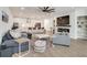 Bright, open living room with modern fireplace, large sectional, and kitchen view at 1072 Brookglynn Trce, Decatur, GA 30032