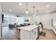 Open-concept living space with hardwood floors and a large island overlooking the living room at 1072 Brookglynn Trce, Decatur, GA 30032