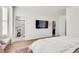 Bright main bedroom with large TV, walk-in closet, and ensuite bathroom at 1072 Brookglynn Trce, Decatur, GA 30032