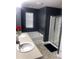 Well-lit primary bathroom with a soaking tub, a separate shower, and double sink vanity at 11547 Hathaway Dr, Hampton, GA 30228