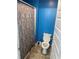 Bathroom with light blue walls and tiled floors at 11547 Hathaway Dr, Hampton, GA 30228