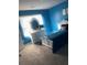 Bright blue bedroom with furniture and natural light at 11547 Hathaway Dr, Hampton, GA 30228