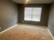 Bedroom with carpeted floor and a window at 11547 Hathaway Dr, Hampton, GA 30228