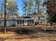 Yard with shed, sunroom, picnic table, and fire pit at 582 Rebecca St, Lawrenceville, GA 30046