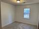 Spacious bedroom with neutral walls and carpeted floors at 582 Rebecca St, Lawrenceville, GA 30046