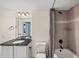 Bathroom with granite vanity and tub shower at 1280 W Peachtree Nw St # 3306, Atlanta, GA 30309