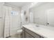 Bright bathroom featuring a vanity and shower-tub combo with a ruffled curtain at 396 Silverbell Way, Marietta, GA 30060