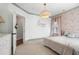 Charming bedroom with floral wallpaper, accent lighting, and bright windows at 396 Silverbell Way, Marietta, GA 30060