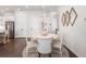 Charming dining area featuring an elegant chandelier and views of the open floor plan at 396 Silverbell Way, Marietta, GA 30060