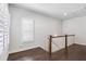 Hallway area with wood floors and trim, features a window with stylish shutters at 396 Silverbell Way, Marietta, GA 30060