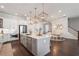 Modern kitchen with a central island, stainless steel appliances, and open layout, ideal for entertaining and Gathering gatherings at 396 Silverbell Way, Marietta, GA 30060