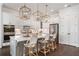 Gourmet kitchen with stone countertops, stainless steel appliances, and a central island with seating at 396 Silverbell Way, Marietta, GA 30060