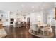 Open-concept kitchen and dining area boasting an island with bar seating and modern finishes at 396 Silverbell Way, Marietta, GA 30060