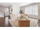 Spacious living room with a large sectional sofa, plantation shutters, and hardwood flooring at 396 Silverbell Way, Marietta, GA 30060