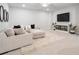 Spacious living room is beautifully decorated with stylish furnishings and a large television for ultimate relaxation and entertainment at 396 Silverbell Way, Marietta, GA 30060