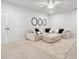 Cozy living room featuring a sectional sofa, a plush rug, three decorative mirrors, and recessed lighting at 396 Silverbell Way, Marietta, GA 30060