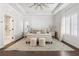 Bedroom features tray ceilings, neutral decor, and lots of natural light from a large window at 396 Silverbell Way, Marietta, GA 30060