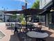 Charming outdoor seating area with umbrellas and tables at a cafe, perfect for enjoying a meal at 396 Silverbell Way, Marietta, GA 30060