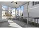 Relax in this screened porch overlooking manicured lawns and charming neighborhood homes at 396 Silverbell Way, Marietta, GA 30060