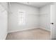 Walk-in closet features white walls, carpet floors, and a large window at 396 Silverbell Way, Marietta, GA 30060