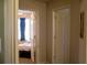 Hallway with doors to bedrooms and bathroom at 106 Gwenellen Dr, Locust Grove, GA 30248