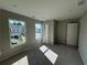 A modern, light-filled room with carpet and a window that offers plenty of natural light at 110 Okeechobee Way, Braselton, GA 30548