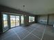 Spacious living area with recessed lighting, large windows, and a sliding glass door to the patio at 110 Okeechobee Way, Braselton, GA 30548