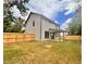 Spacious backyard with a large covered patio and wooden privacy fence at 1679 Eastside Parc St, Atlanta, GA 30316