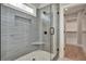 Spa-like bathroom with a large walk-in shower, built-in seat, and grey tile at 1679 Eastside Parc St, Atlanta, GA 30316