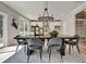 Spacious dining room features a large table, chandelier, and hardwood floors at 1679 Eastside Parc St, Atlanta, GA 30316