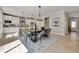 Elegant dining room features a large table, chandelier, and hardwood floors at 1679 Eastside Parc St, Atlanta, GA 30316