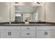Double vanity with dark countertop and modern fixtures at 1679 Eastside Parc St, Atlanta, GA 30316