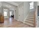 Light-filled entryway with hardwood floors and view of staircase at 1679 Eastside Parc St, Atlanta, GA 30316