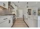 Modern kitchen with white cabinets and a herringbone tile backsplash at 1679 Eastside Parc St, Atlanta, GA 30316