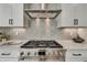 Stainless steel range and herringbone backsplash in modern kitchen at 1679 Eastside Parc St, Atlanta, GA 30316