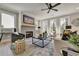 Spacious living room boasts a fireplace, large windows, and comfortable seating at 1679 Eastside Parc St, Atlanta, GA 30316