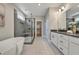 Main bath with soaking tub, walk-in shower, and double vanity at 1679 Eastside Parc St, Atlanta, GA 30316