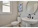 Stylish powder room with pedestal sink and elegant decor at 1679 Eastside Parc St, Atlanta, GA 30316
