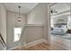 Upstairs hall with light fixture and bedroom view at 1679 Eastside Parc St, Atlanta, GA 30316