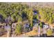 Aerial view of house and surrounding wooded area at 166 Greentree Trl, Temple, GA 30179