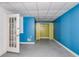 Unfinished basement with blue and yellow walls at 166 Greentree Trl, Temple, GA 30179
