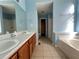 Bathroom boasts double sinks, garden tub, and shower at 166 Greentree Trl, Temple, GA 30179