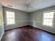 Spacious bedroom with wood flooring and ceiling fan at 166 Greentree Trl, Temple, GA 30179
