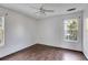 Simple bedroom with wood flooring and large windows at 166 Greentree Trl, Temple, GA 30179